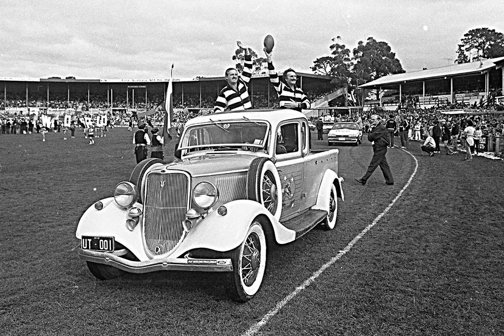 Black and white afl celebration in a ford