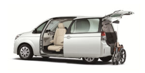 A Silver Toyota Spade Welcab shown from the side, ephasisiing the swivel mobility seat and wheelchair lift in rear