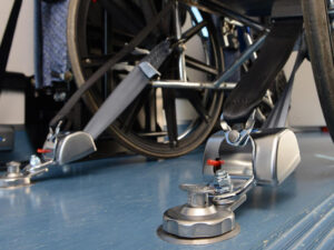 Secure wheelchair restraint systems