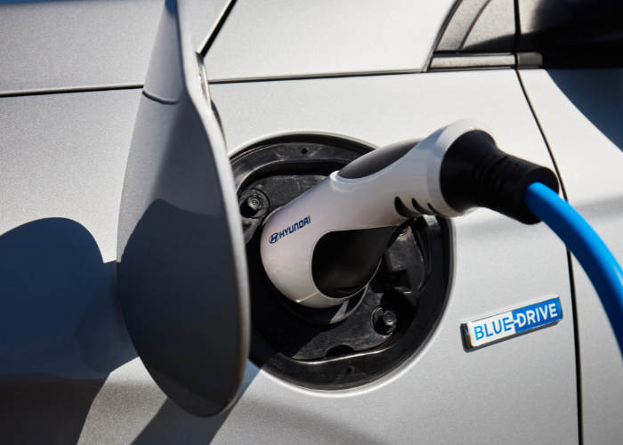 An EV vehicle plugged in for charging - Plug-in Hybrid vehicle