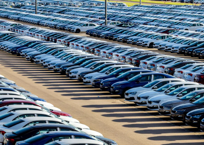 Showing a car yard full off different car brands, all owned by a single company in the car industry