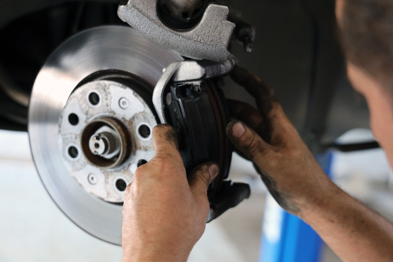 car repair and maintenance Close up of a mechanic doing brake repairs in geelong