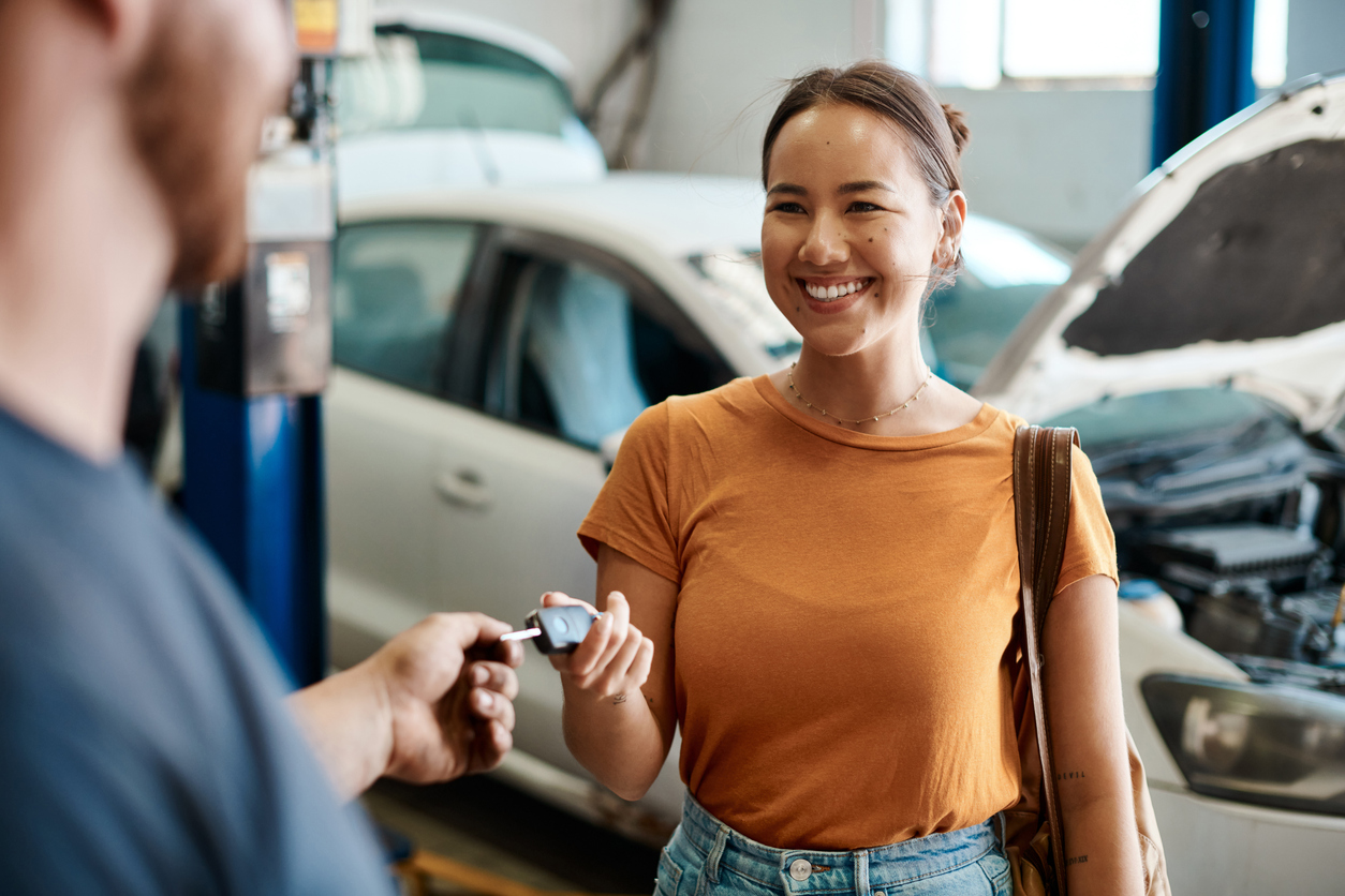 Happy driver is handed car keys by the best mechanic Geelong