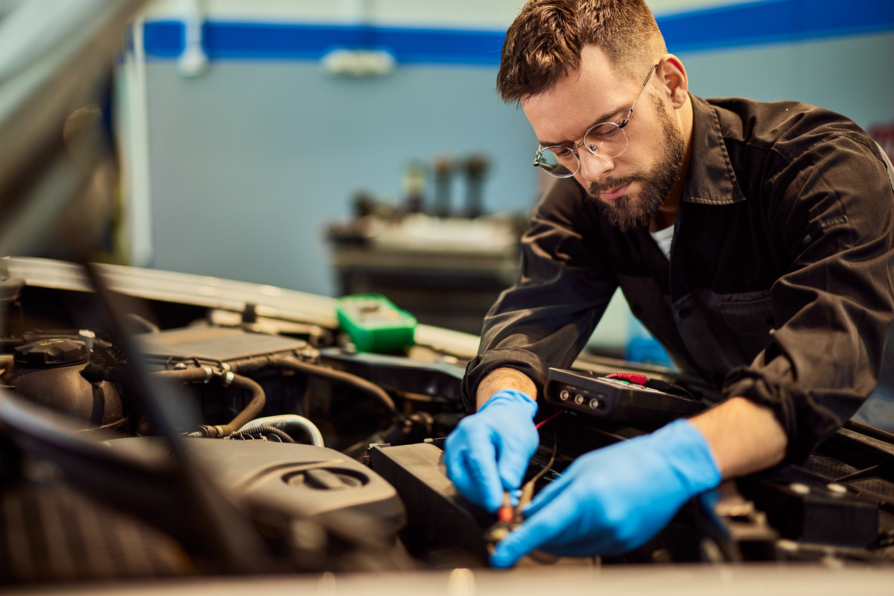 car repair and maintenance Geelong mechanic leaving over a car engine in a car workshop